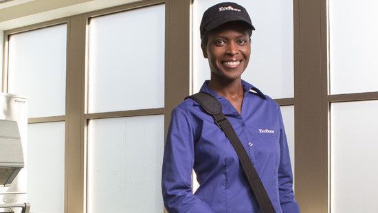 ecosure field specialist in blue shirt in back of house kitchen
