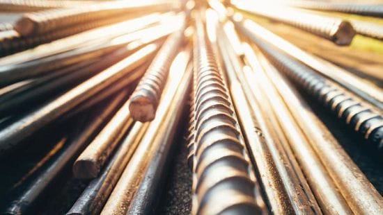Close up image of light shining off steel bars.